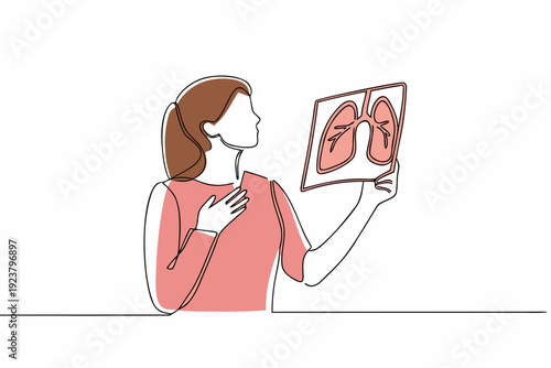 Woman examining a lung x ray possibly indicating a health concern