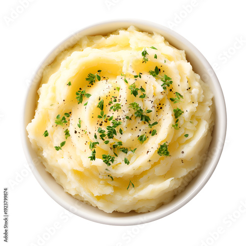 Creamy mashed potatoes garnished with fresh herbs in a white bowl