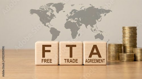 Free Trade Agreement FTA concept with coins and world map background