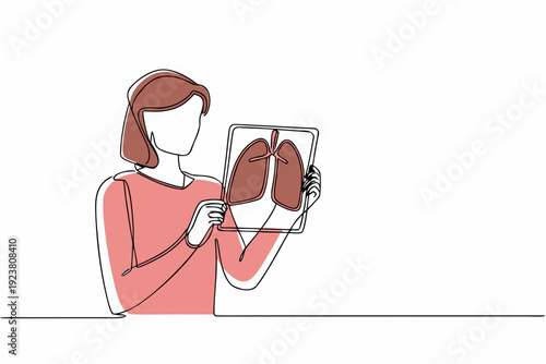 Woman examining an x ray image of lungs on a digital tablet