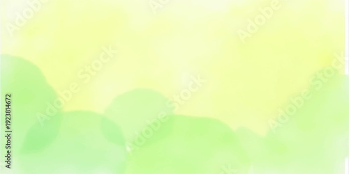 Bright spring nature background featuring vibrant green leaves and grass in a sunny meadow with soft bokeh light and a clear blue sky
