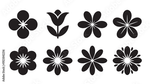 A set of eight black vector illustrations featuring various flower shapes, including a tulip and multiple abstract floral designs, for decorative use.