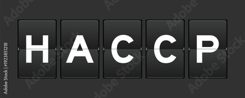 Black color analog flip board with word HACCP (Hazard Analysis Critical Control Points) on gray background