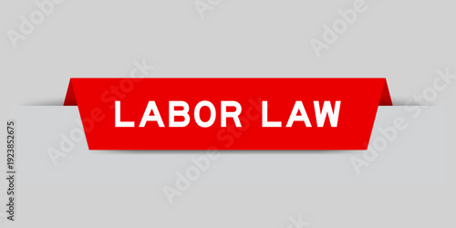 Red color inserted label with word labor law on gray background