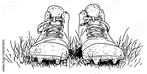 Close up hand drawn sketch of football boots on a grassy field