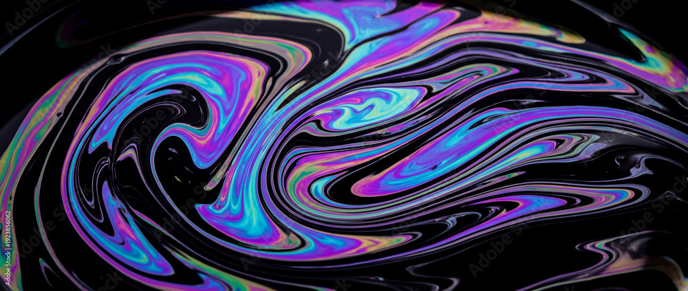 Fototapeta premium Iridescent Fluid Swirls with Vibrant Neon Colors on Black Surface