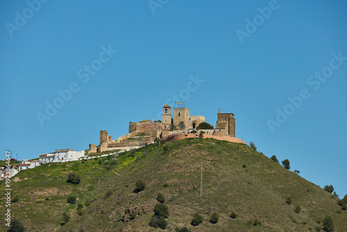 Álora castle fortress crowning hill under clear sky