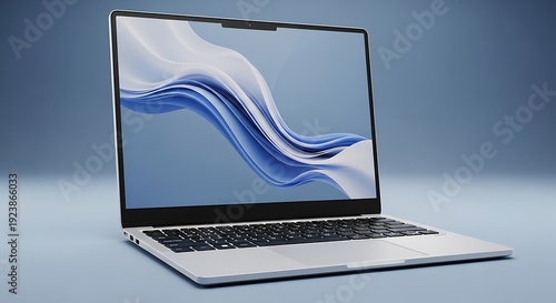 Sleek modern laptop displaying vibrant blue wave design on its lid