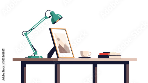 Modern workspace arrangement with adjustable desk lamp, framed picture, coffee cup and stack of books on a table.