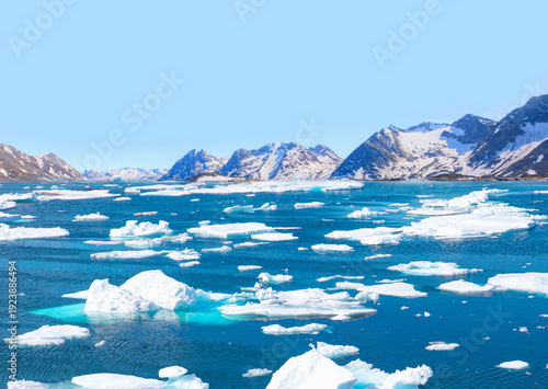Melting icebergs by the coast of Greenland, on a beautiful summer day - Melting of a iceberg and pouring water into the sea - Greenland