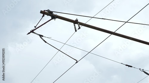 Tram pantograph collecting electricity from overhead catenary lines