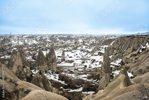 Wallpaper Mural Panoramic landscape view across rural countryside valley during winter in Cappadocia Central Anatolia Turkey with geological fairy chimney rock formations and snow Torontodigital.ca
