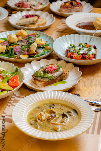 Картината върху платно Colorful plates filled with gourmet dishes invite everyone to enjoy a delightful