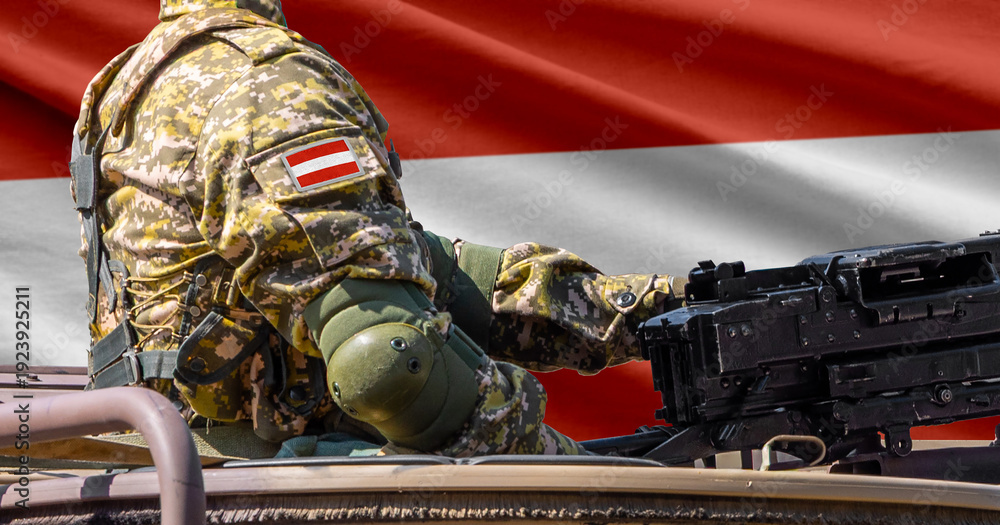 Obraz premium Austria flag with soldier at machine gun turret in front of it. Closeup side view.