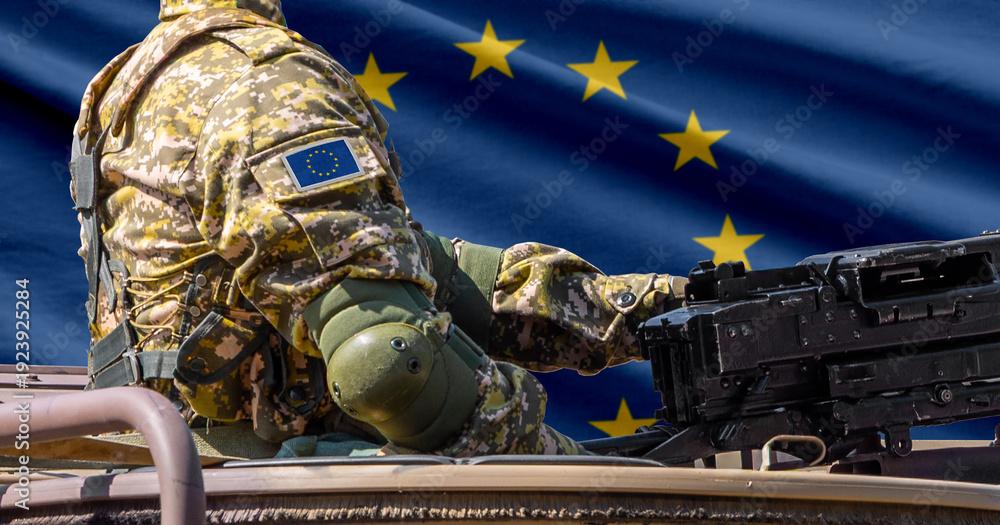 Naklejka premium European union flag with soldier at machine gun turret in front of it. Closeup side view.