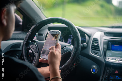 Εκτύπωση καμβά Person using mobile phone and texting while driving, creating a dangerous road safety hazard