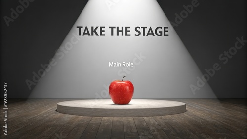 Red apple highlighted on stage in spotlight for main role