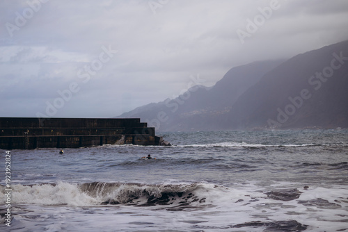 a surfer on the waves of the Atlantic Ocean