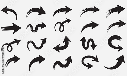 Collection of black hand drawn brush stroke arrows pointing in various directions on a light gray background