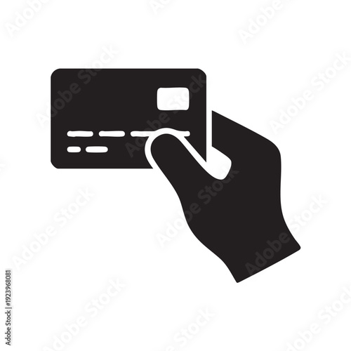 A hand holding a credit card with a finger pointing to it from a close-up viewpoint