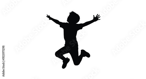 Joyful child leaping in the air with arms outstretched silhouette