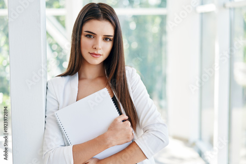 Free Download Confident business woman holding documents and looking at camera in modern creative office - GFXLoad