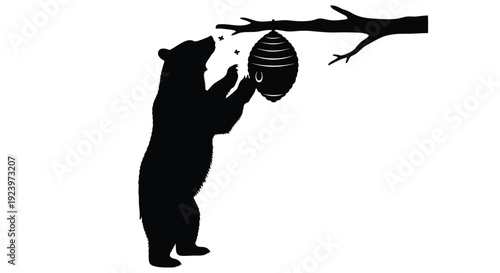 Bear reaching for beehive on branch stark black silhouette