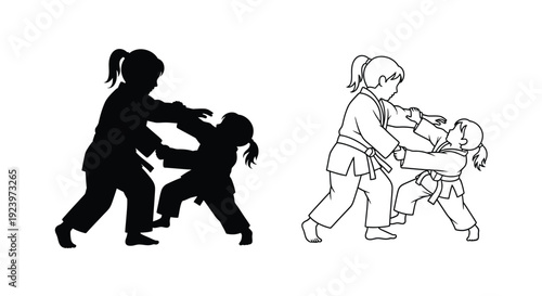 Two young girls practicing martial arts one in silhouette
