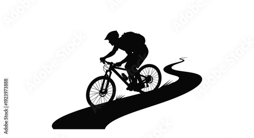 Mountain biker rides a winding trail a dramatic black silhouette