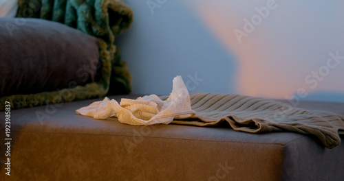 Photos Clothes are strewn across the living space, highlighting disorganization and clutter