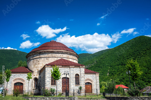 Round historic temple above hills near Sheki