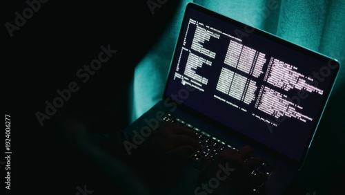 Photos Codeintensive dark workspace, Dimly lit office with programmer overseeing code o