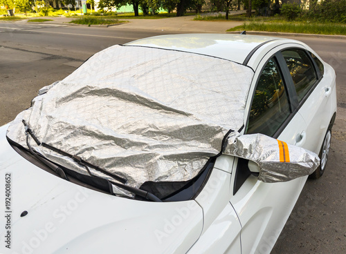 A protective screen for the car windshield that fits over the top
