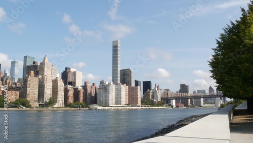 New York City Manhattan Midtown Queensboro bridge architecture, United States. Metallic bridge over East River, East Side residential district skyline from Roosevelt island. NYC cityscape, Turtle Bay.