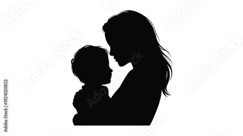 Silhouette of a mother tenderly holding and kissing her baby on the cheek with love and care