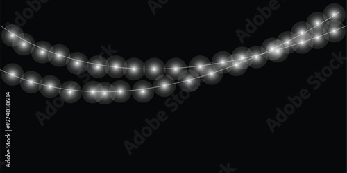 Glowing white string lights illuminate a dark celebration background creating a festive and magical atmosphere