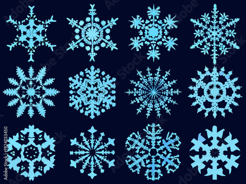 A collection of digitally created light blue snowflakes on a dark background