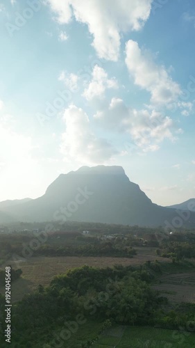vdo drone move at Aerial View of Doi Luang Chiang Dao Mountain with Rural Landscape and Sun Rays, Chiang Mai Thailand