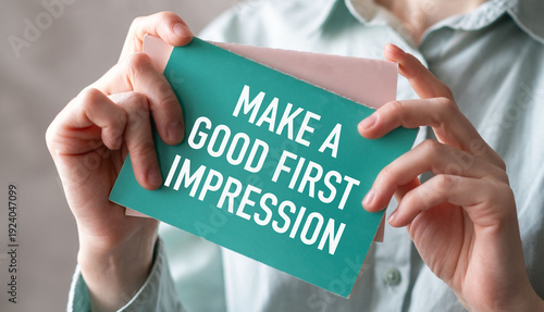 Bild auf Leinwand Person holding card with Make a Good First Impression text