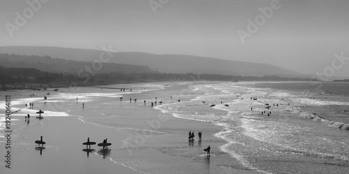 Surfers heading to the waves