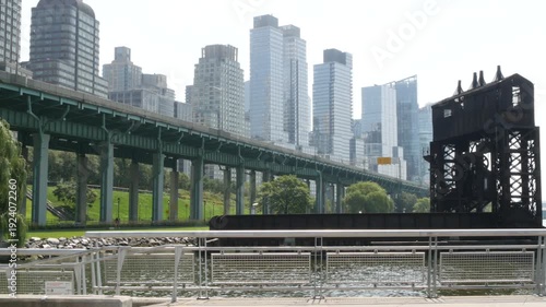 New York City Riverside Park South Manhattan United States. Modern residential building Upper West Side. Urban skyscraper skyline. Miller highway remnant, elevated viaduct. Industrial gantry dock pier