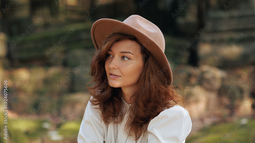Fototapeta premium Angkor Temple Ruins Travel Portrait Of Woman In Hat, Side View, Cambodia