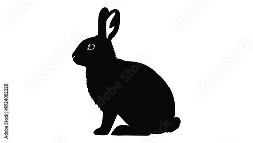 A black silhouette of a rabbit sitting on the ground isolated on white background, Vector