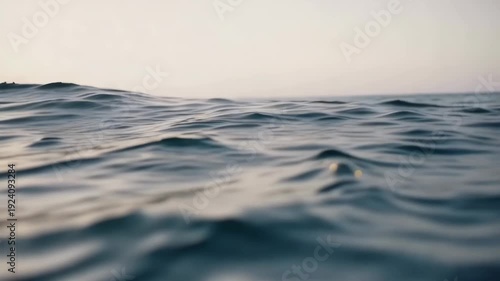 Gentle ocean waves at sunset: soothing seascape progression in tranquil twilight