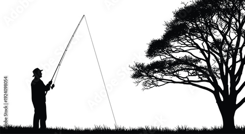 Man in silhouette fishing beside tree on grassy field