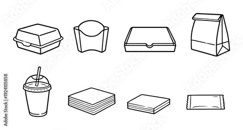 Fast food packaging and disposables arranged on dark gray background