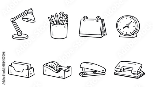 Desk lamp pen holder calendar and stapler on dark backdrop