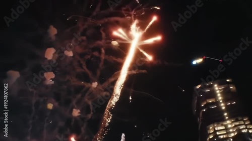 Fireworks Display Illuminates Night Sky in Urban Celebration Event