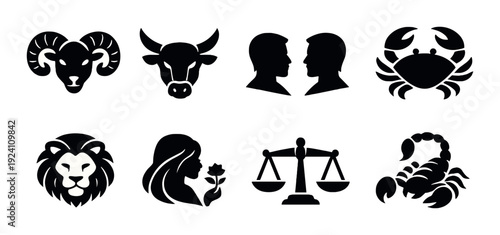 Zodiac animal and symbol silhouettes arranged on dark background