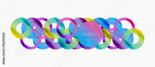 Abstract colorful rings overlap creating dynamic visual effect. Gradient hues blend smoothly, forming modern design element.